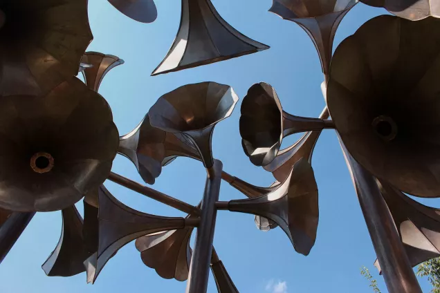 Megaphones against a blue sky. Photo.